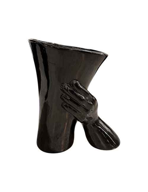 Gloss Black Vase Held By Hand And Wrist