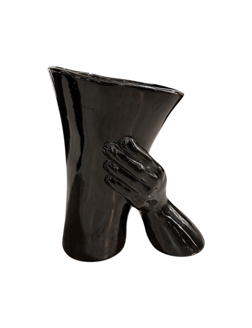 Gloss Black Vase Held By Hand And Wrist